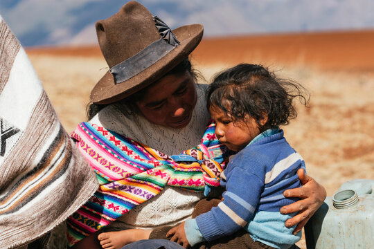 Indigenous mom holding her son