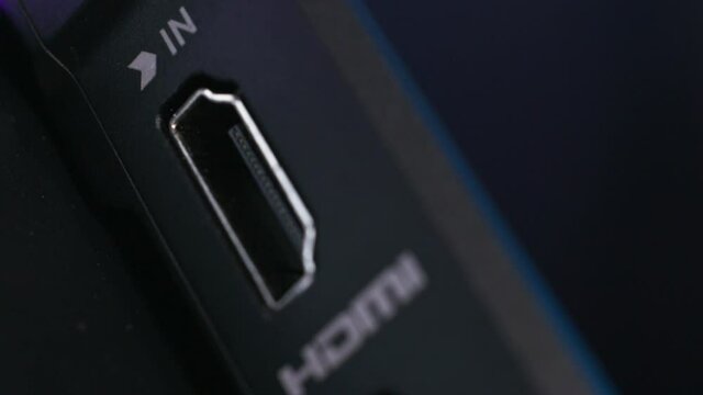 Close up of the external power and HDMI connector. Action. Side view of a computer or laptop device, modern technologies concept. 