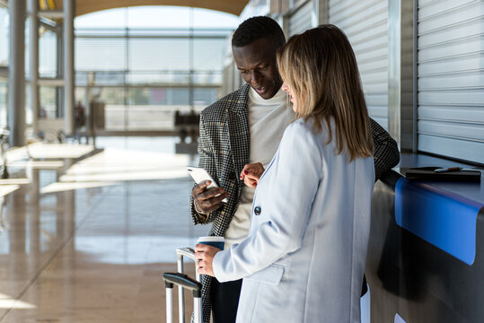 business coworkers standing on the phone at the airport waiting for the flight
