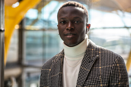 young elegant and attractive black man wearing stylish jacket