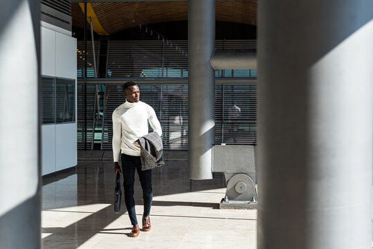 young businessman walking at the airport terminal