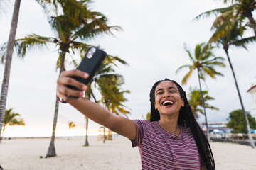 Girl making a selfie on the beach
