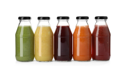 Bottles of fresh juices on white background