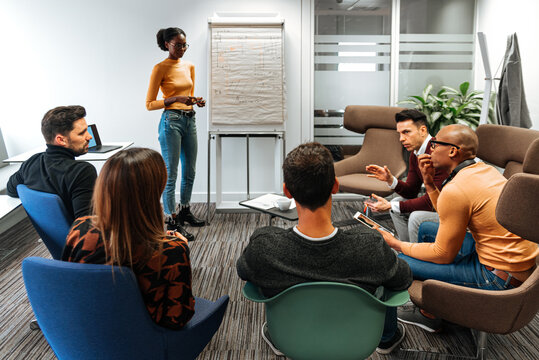 Group of business partners listening to presentation with flip c