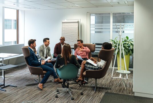 Executive worker discussing project with partners in office