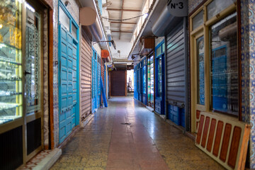 Essaouira, Morroco, Africa - April 29, 2019: Closed stores in a market's corridor
