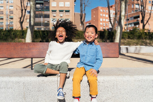 Multiethnic children laughing at the park.