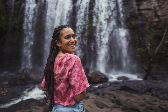 Black girl in a waterfall