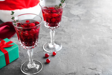 Delicious Christmas cocktail with liqueur on grey table. Space for text