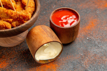 Top view of crispy fried chicken on the middle of mixed color background