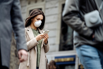 Woman covering her face with protective mask