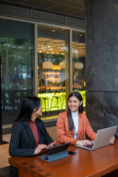 Two asian colleagues working