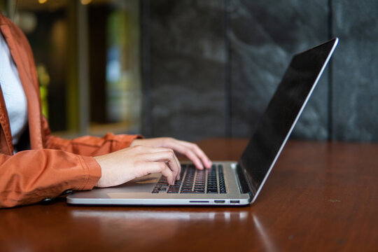 woman typing on computer