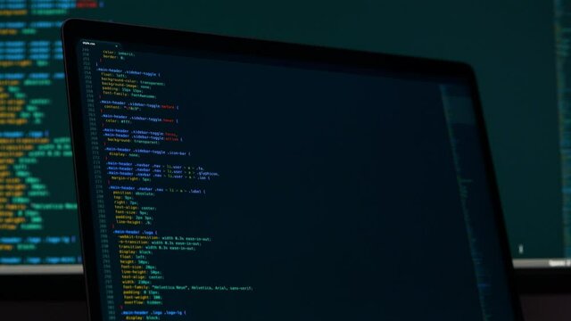 Real CSS code. Front end web development. CSS code on laptop screen. Web design concept.
