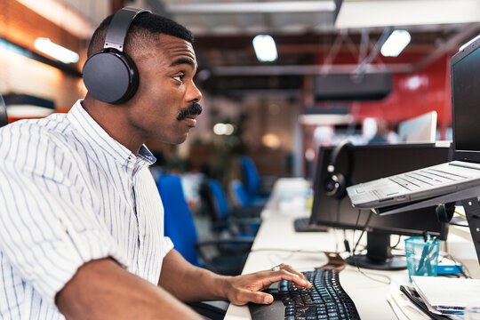 Focussed businessman working in creative office