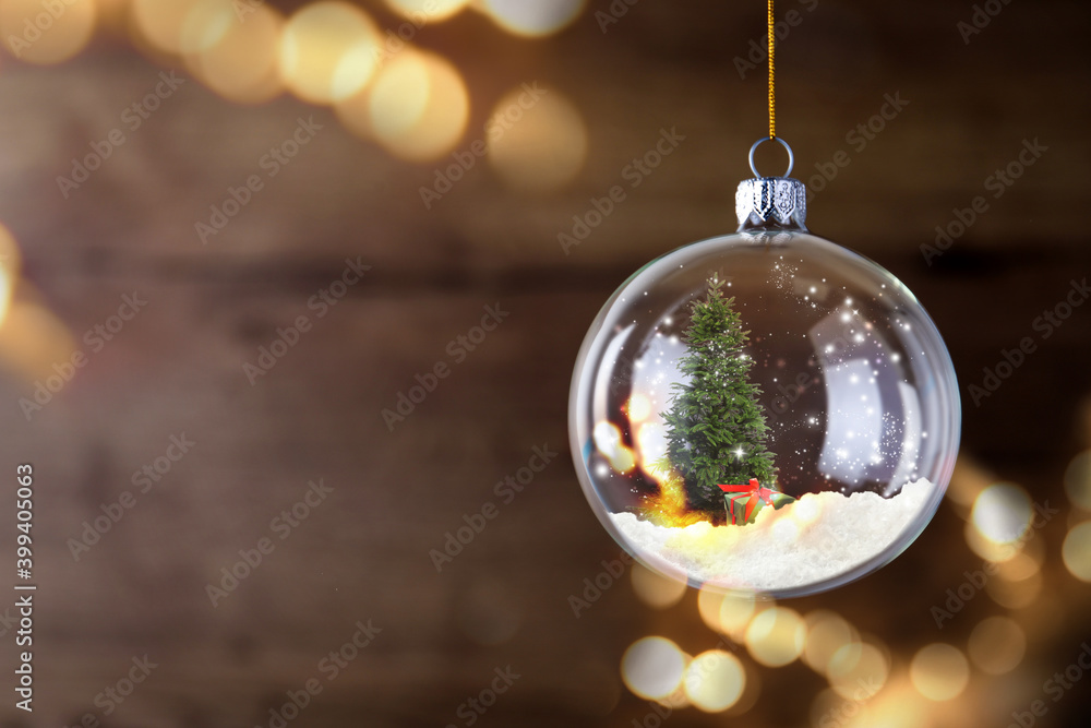 Wall mural beautiful glass ball with christmas tree and gift on blurred background, space for text. bokeh effec