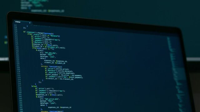 Real Javascript code. Front end web development. Java script JS code on laptop screen. Web design concept.