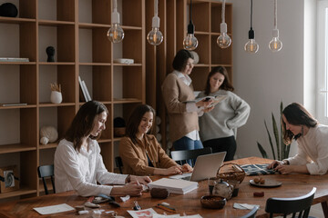 Women's team creating designs in the office