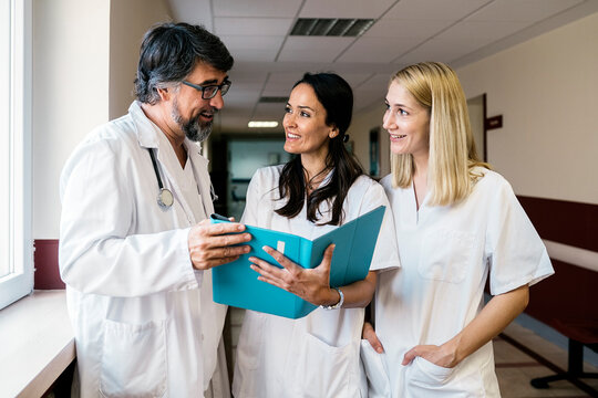 Doctor and nurses checking a patient results while working in a hospital