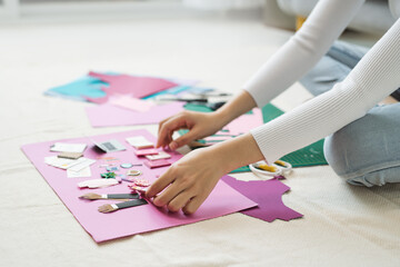 Female hands making craft paper works