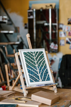 Mosaic on table easel in workshop