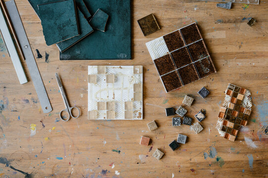 Mosaic pieces on messy table