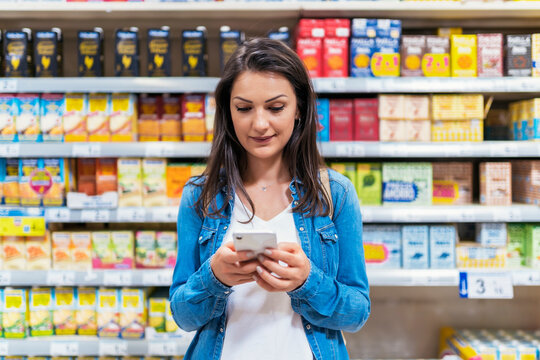 Beautiful woman buying food in a supermarket
