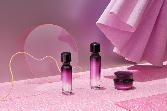 Cosmetic set with luxury packaging on purple background