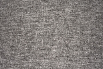 Fototapeta na wymiar Gray fabric background. Grey canvas texture. Bright textile material background. Gray fiber pattern. Checkered textile texture.