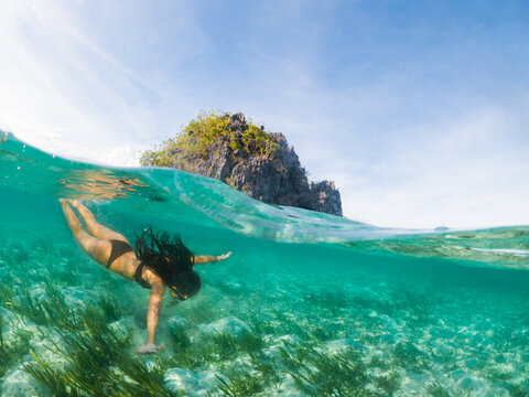 Girl diving in the sea