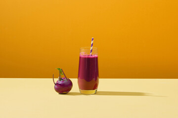 Fresh beets with clear juice in tall glass
