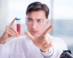 Man doctor checking blood samples in lab