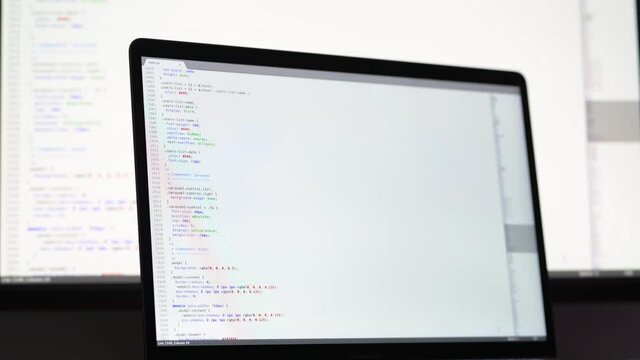 Real CSS code. Front end web development. CSS code on laptop screen. Web design concept.