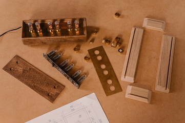 Parts of handmade clock on workbench