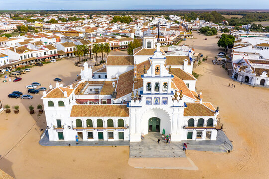 Aerial view of a sanctuary called Ermita del Rocio with the streets covered in dirt in the town of El Rocio, Huelva, Spain.