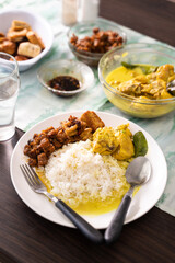 Homemade cooking indonesian food with variety of side dishes