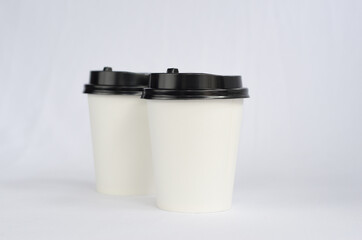 photo white cup plain on white background , mock up glass plastic