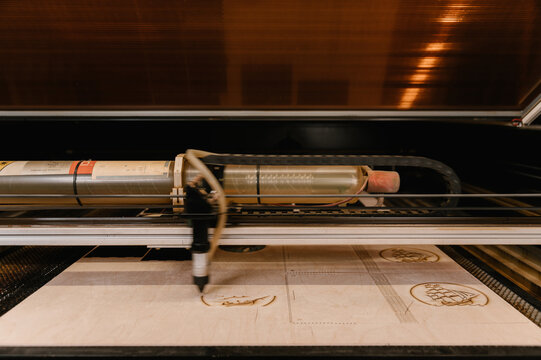 CNC machine burning ornament on wood