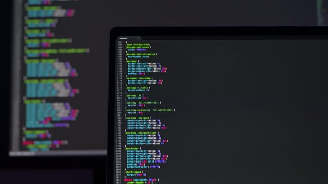 Real CSS code. Front end web development. CSS code on laptop screen. Web design concept.
