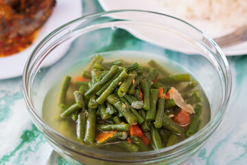 Healthy and delicious Indonesian long beans soup on the table