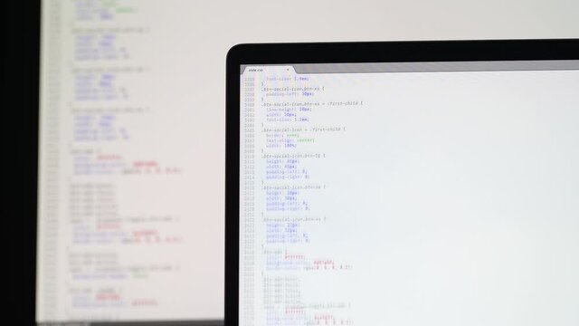Real CSS code. Front end web development. CSS code on laptop screen. Web design concept.