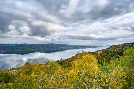 Clouds over&Ocirc;&oslash;&Omega;Lake Constance ale lakeshore forest in autumn