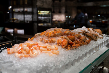 Luxury seafood buffet on ice with prawns, shrimps and crabs