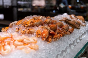 Luxury seafood buffet on ice with prawns, shrimps and crabs