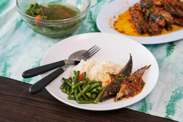 Homemade cooking indonesian food with variety of side dishes