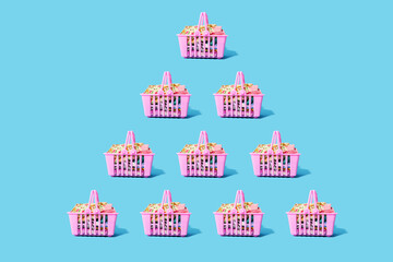 Studio shot of pink shopping baskets arranged in triangle