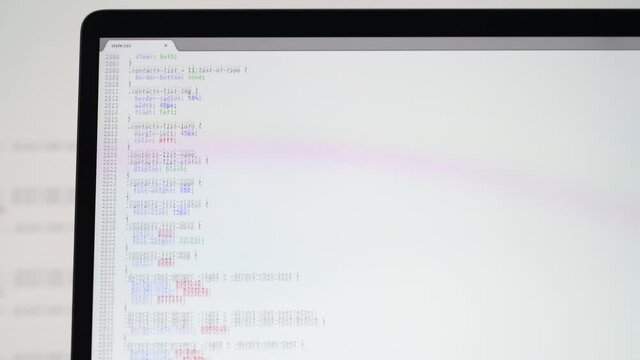 Real CSS code. Front end web development. CSS code on laptop screen. Web design concept.