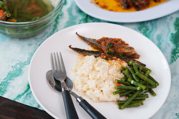 Homemade cooking indonesian food with variety of side dishes