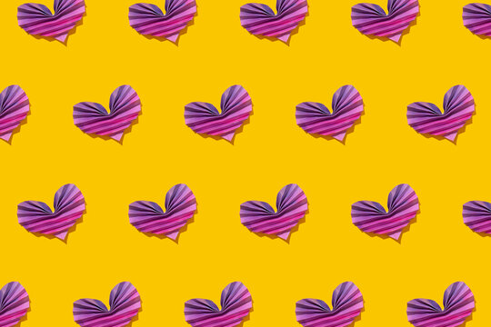 Pattern of pink and purple origami hearts