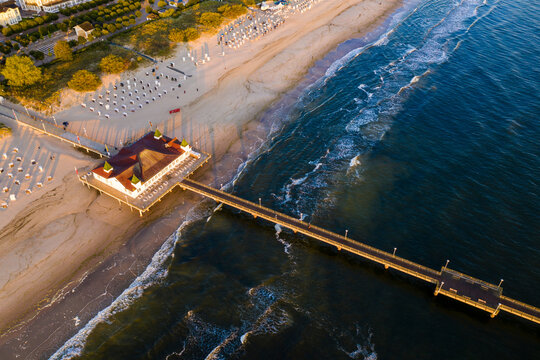 Germany, Mecklenburg-Western Pomerania, Heringsdorf, Aerial view of coastal pier at dawn